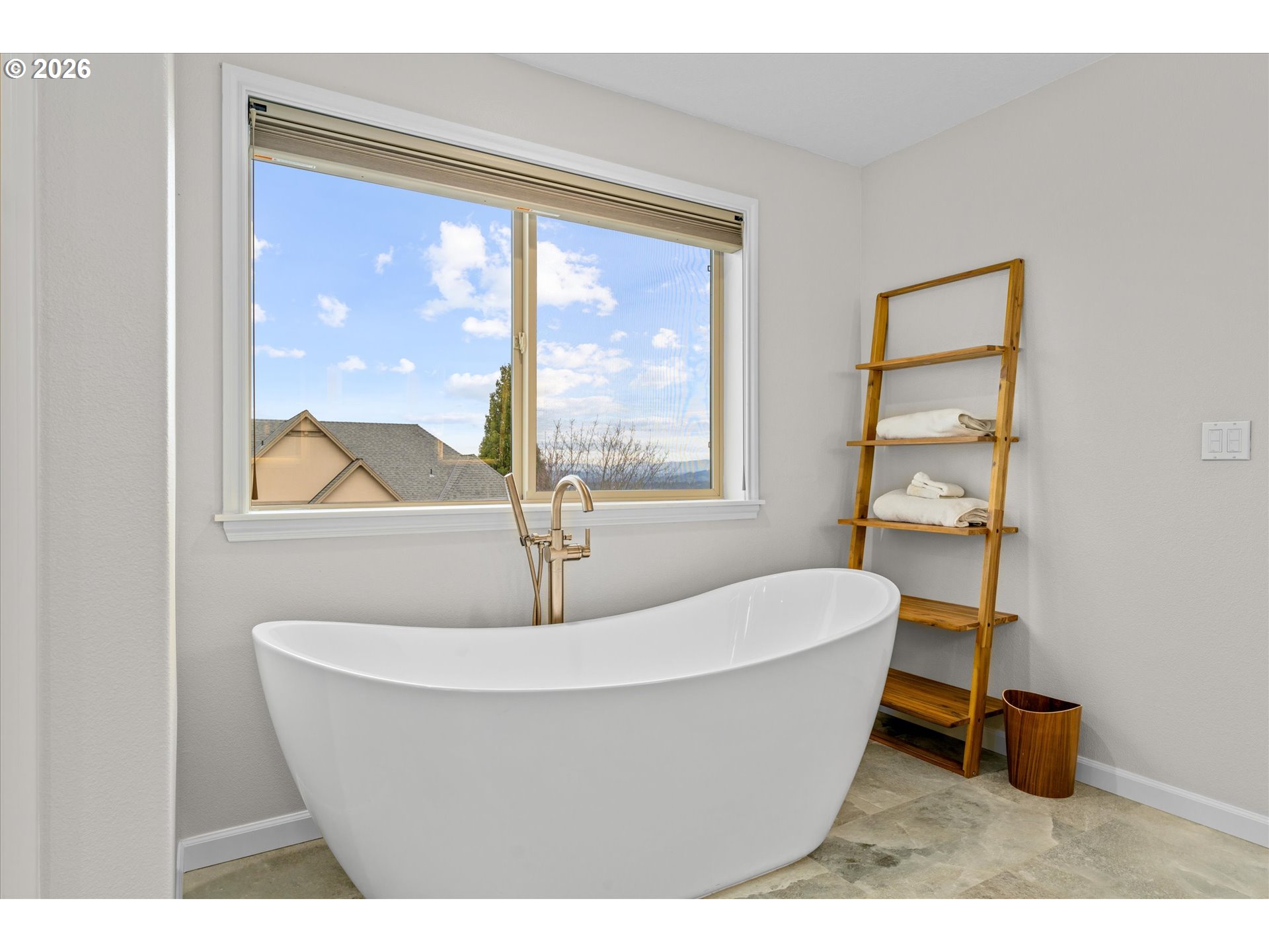 12059 Southwest Stringer Lane Tigard, OR 97224 - Photo 16 of 41 a white bath tub sitting next to a window
