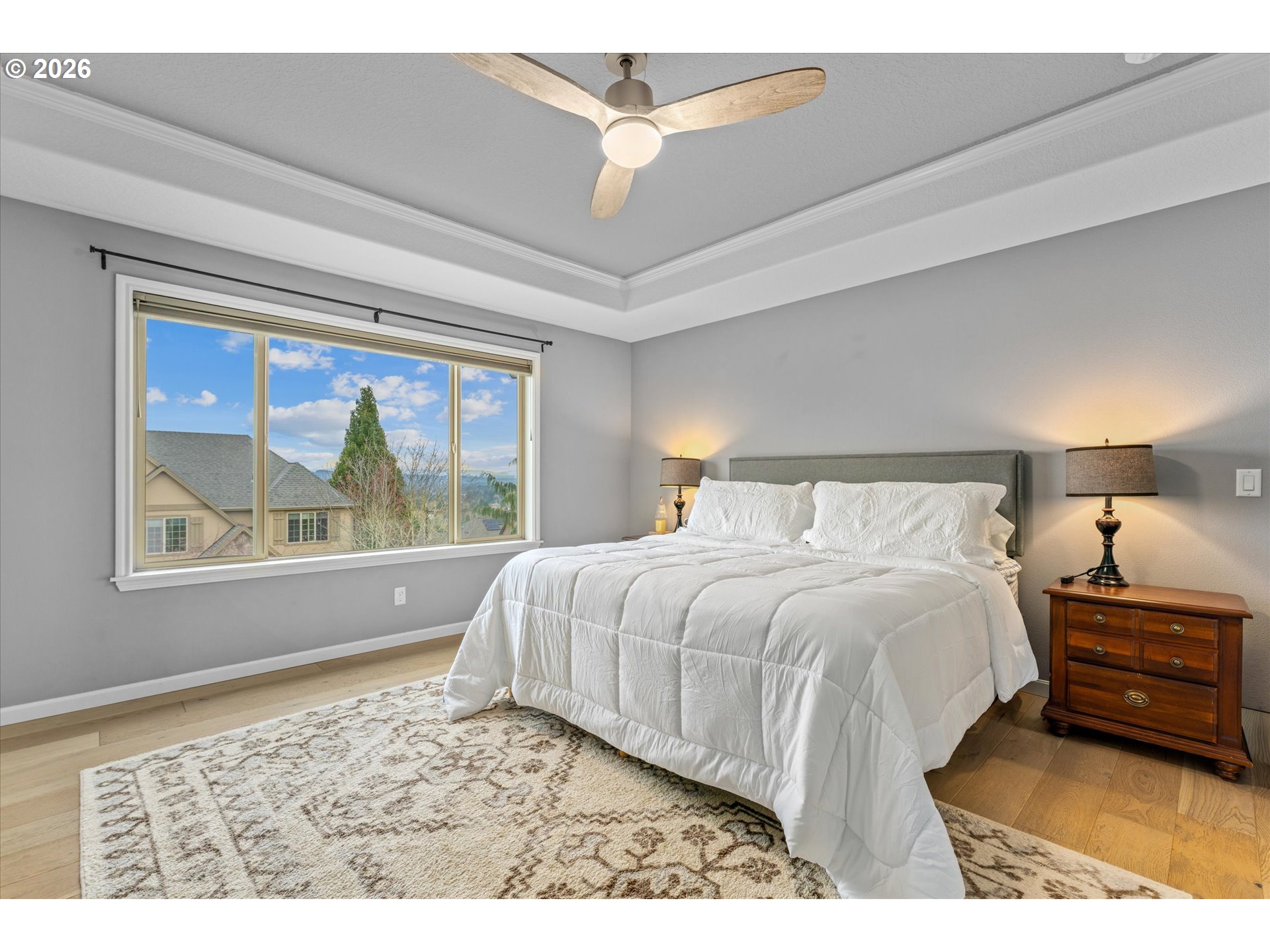 12059 Southwest Stringer Lane Tigard, OR 97224 - Photo 20 of 41 a bedroom with a large bed and a window