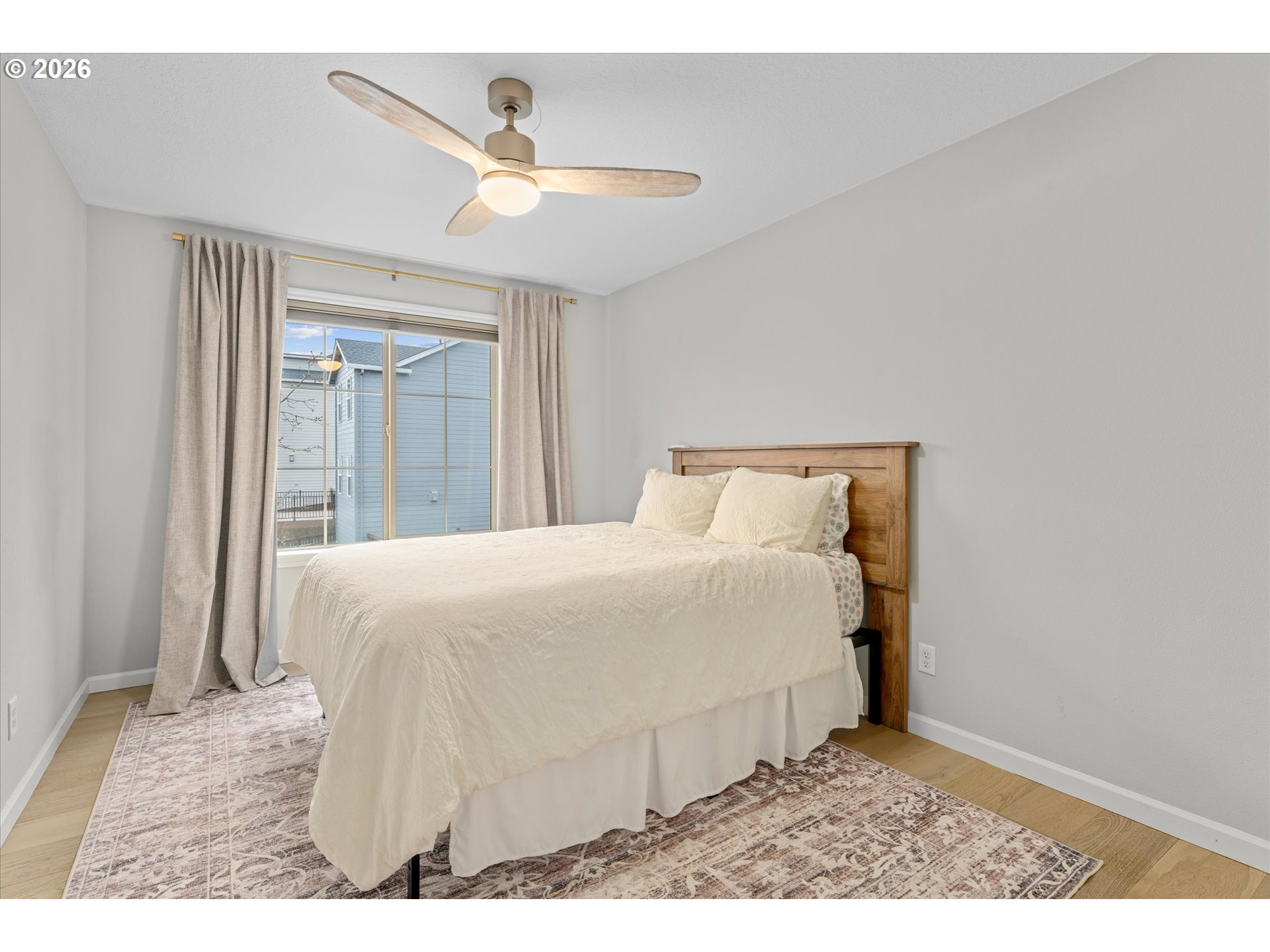 12059 Southwest Stringer Lane Tigard, OR 97224 - Photo 24 of 41 a bedroom with a bed and a ceiling fan