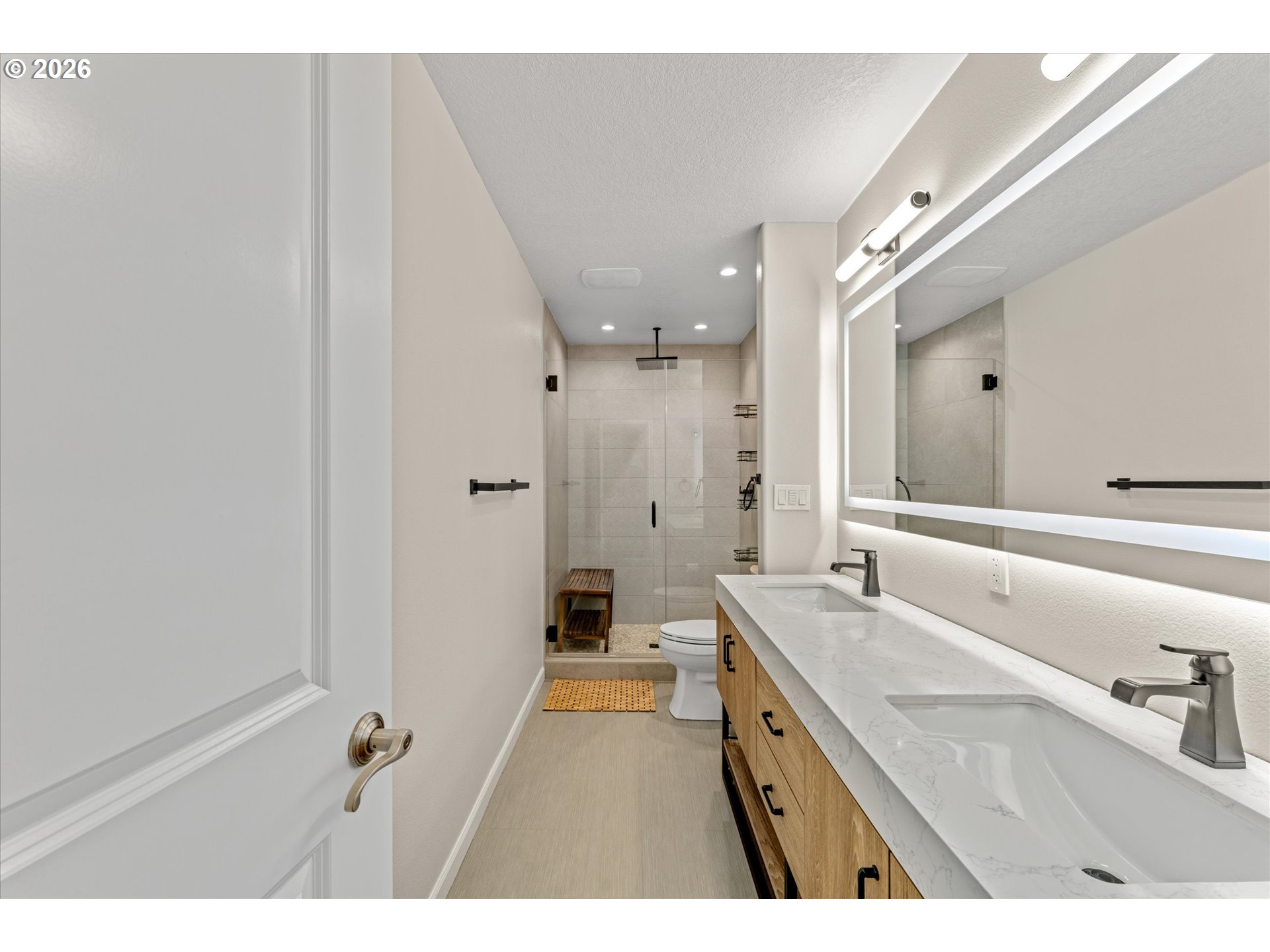 12059 Southwest Stringer Lane Tigard, OR 97224 - Photo 25 of 41 a bathroom with a granite countertop sink a mirror and a shower