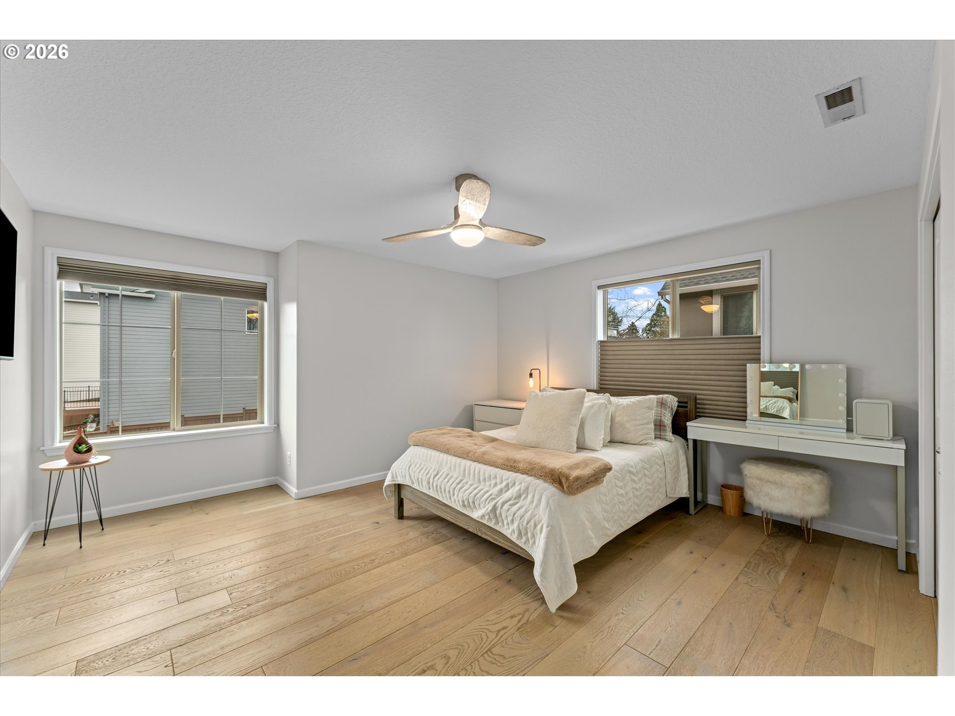 12059 Southwest Stringer Lane Tigard, OR 97224 - Photo 26 of 41 a bedroom with a bed and a large window
