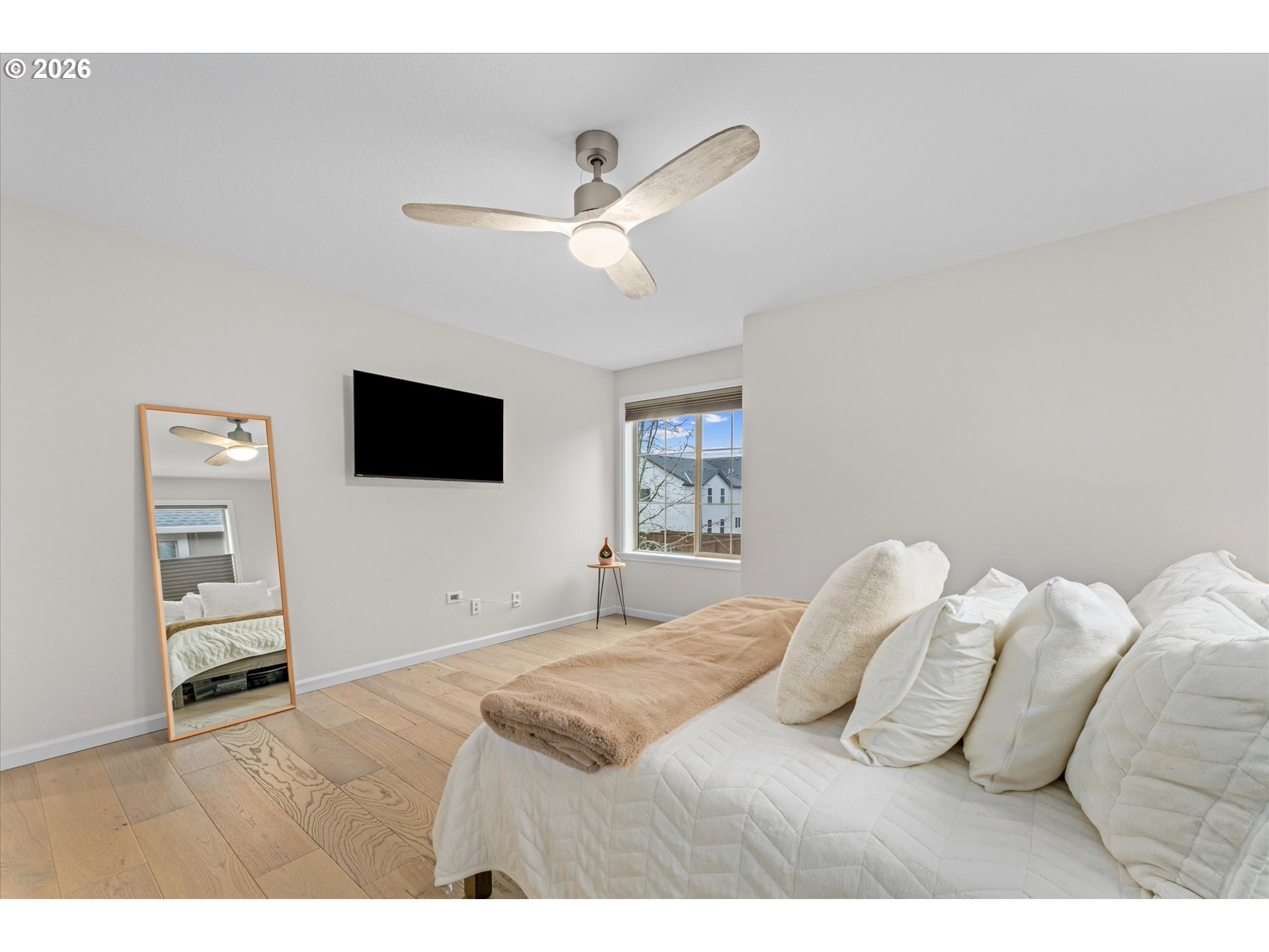 12059 Southwest Stringer Lane Tigard, OR 97224 - Photo 27 of 41 a bedroom with a bed and a flat screen tv