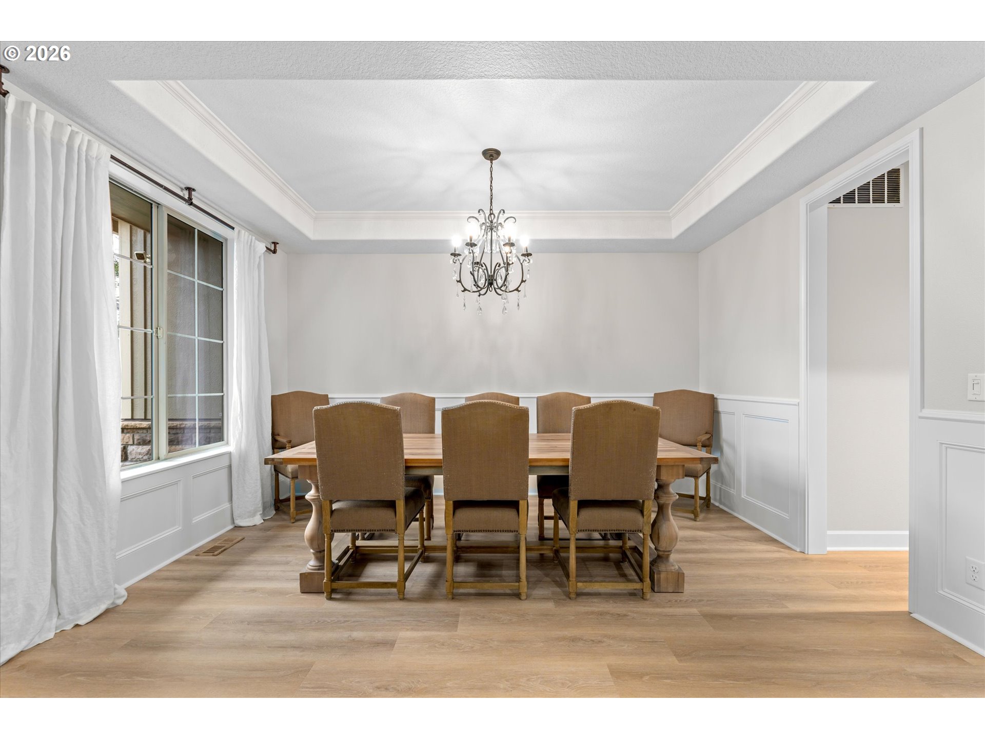 12059 Southwest Stringer Lane Tigard, OR 97224 - Photo 30 of 41 a dining room with furniture a chandelier and wooden floor