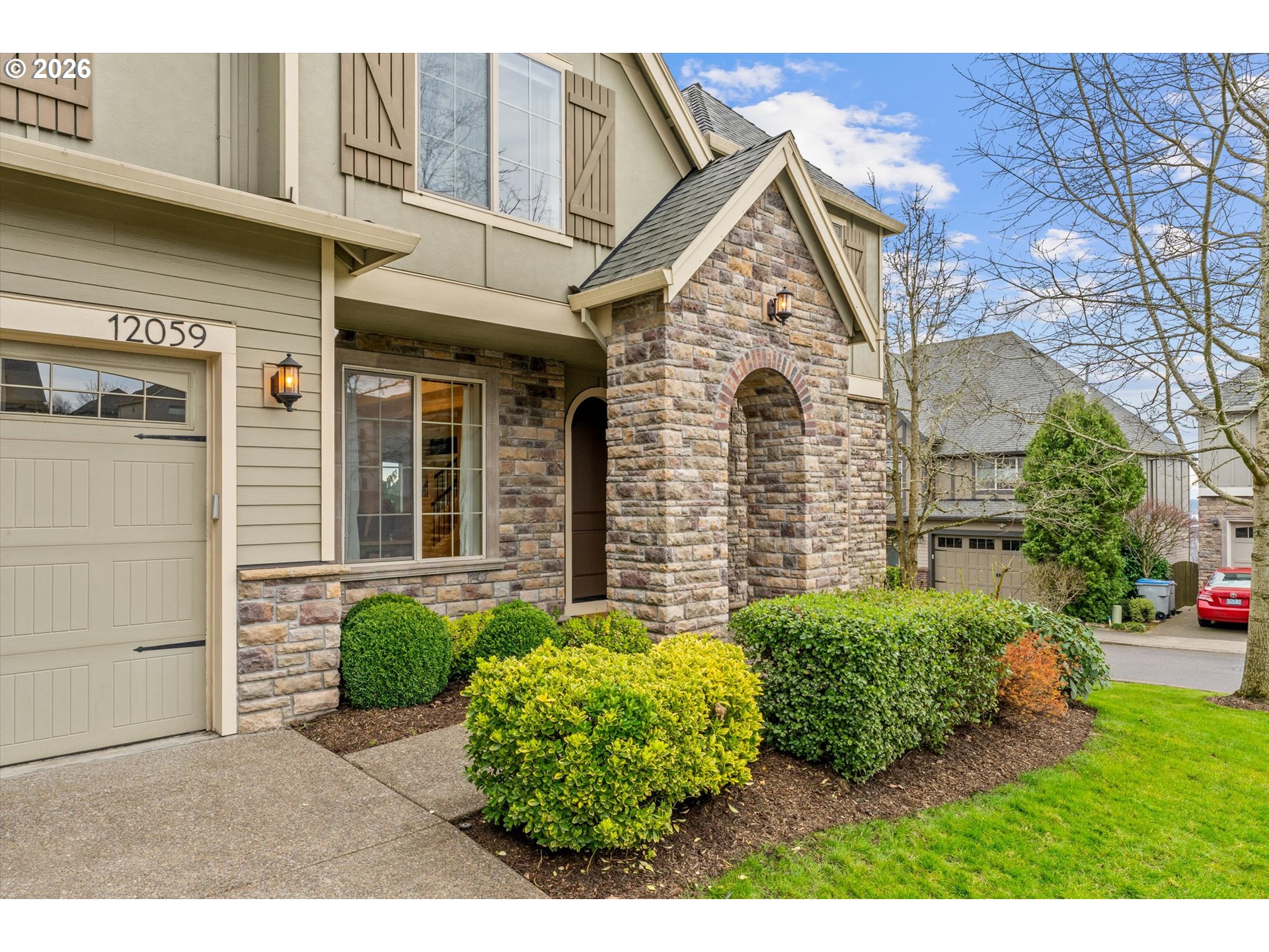 12059 Southwest Stringer Lane Tigard, OR 97224 - Photo 3 of 41 a view of a front of a house with a small yard