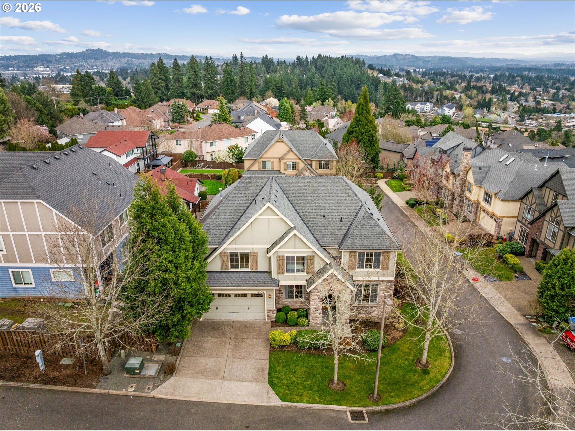 12059 Southwest Stringer Lane Tigard, OR 97224 - Photo 40 of 41 a view of a house with a garden and lake view