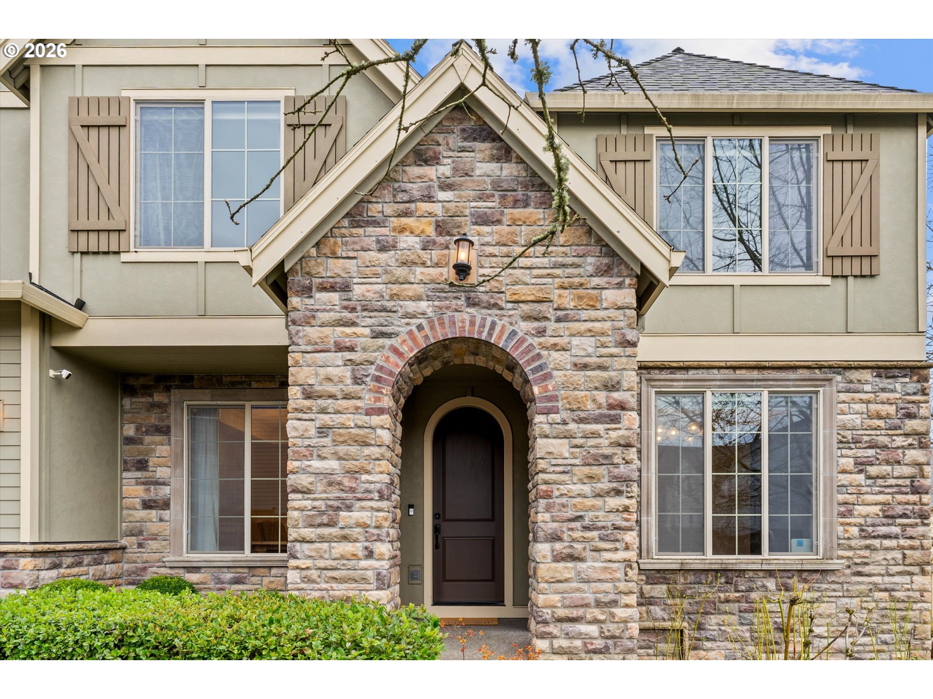 12059 Southwest Stringer Lane Tigard, OR 97224 - Photo 4 of 41 a view of a grey house with large windows