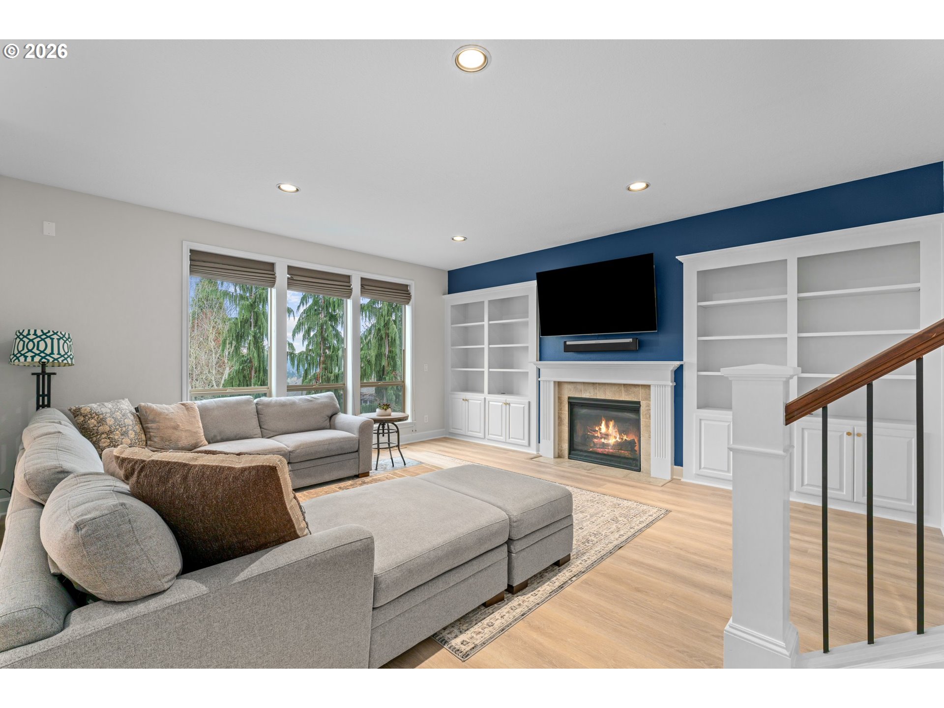12059 Southwest Stringer Lane Tigard, OR 97224 - Photo 6 of 41 a living room with furniture a fireplace and a flat screen tv