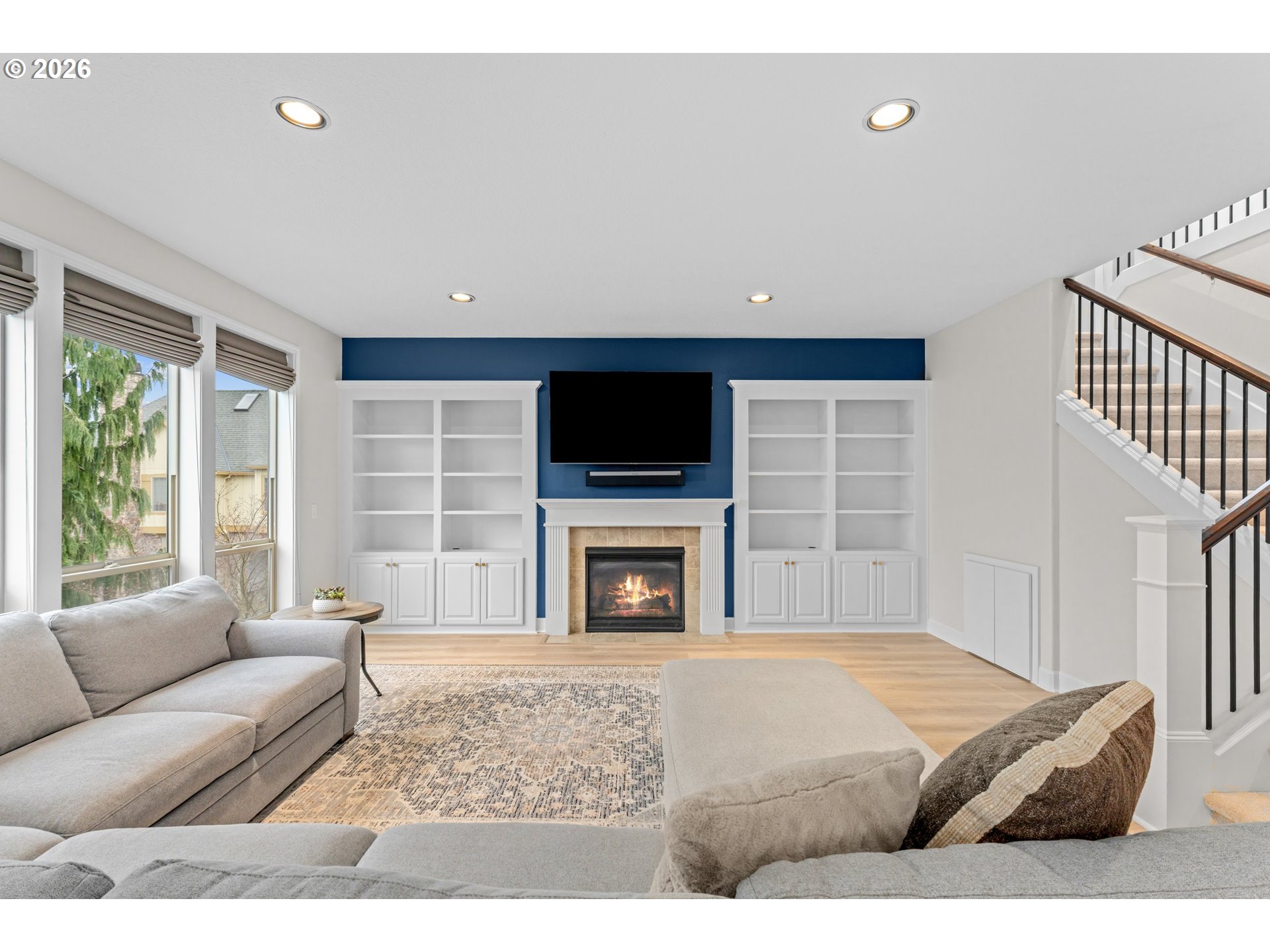 12059 Southwest Stringer Lane Tigard, OR 97224 - Photo 7 of 41 a living room with a flat screen tv and a fireplace