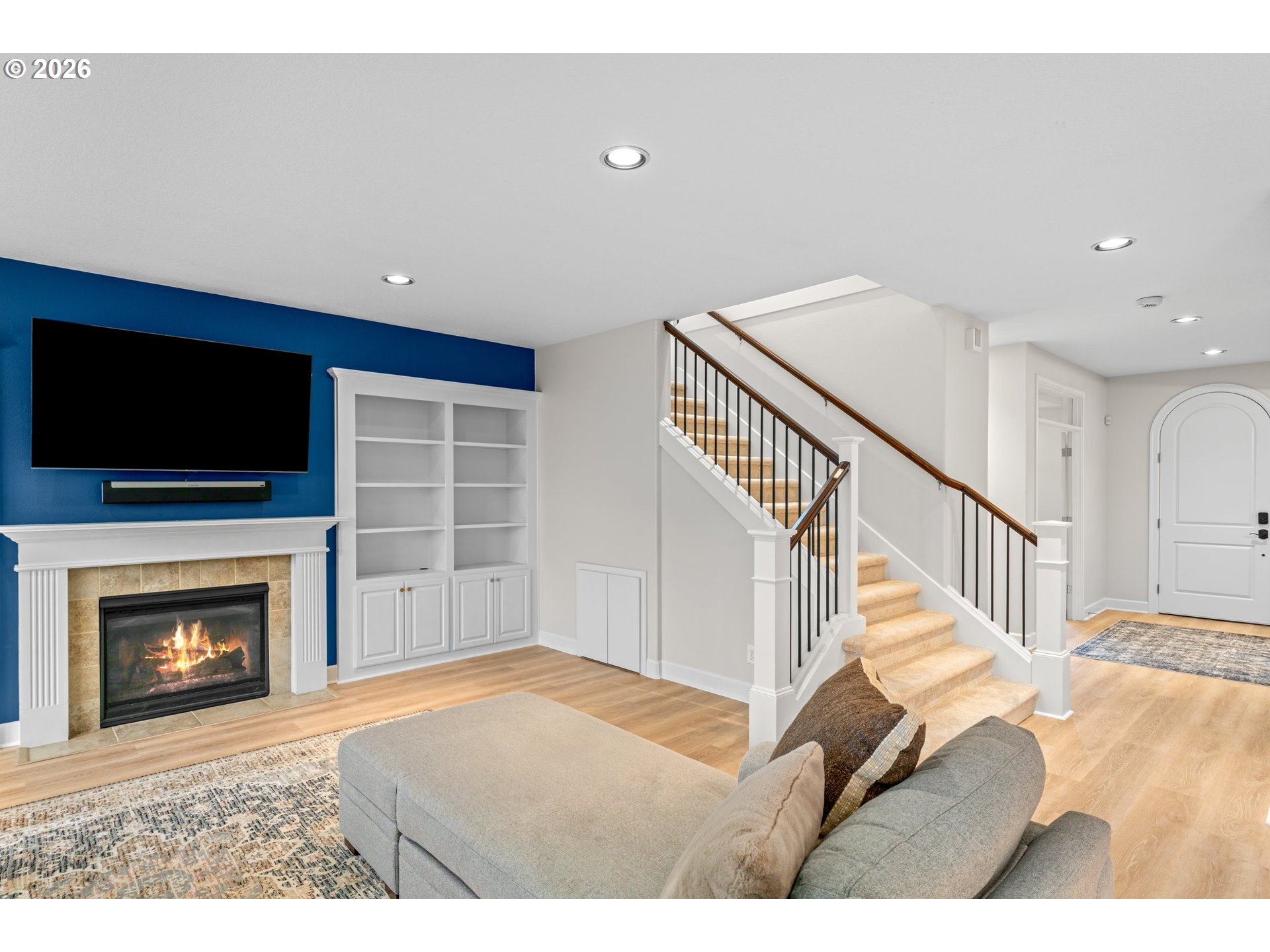 12059 Southwest Stringer Lane Tigard, OR 97224 - Photo 8 of 41 a view of an empty room with wooden floor and a fireplace