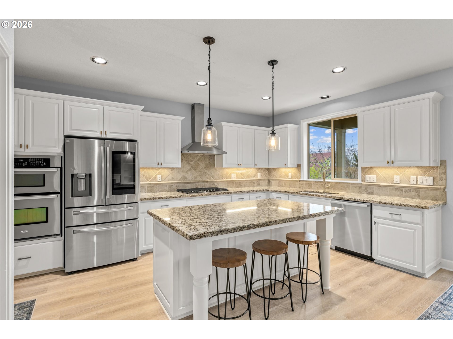 12059 Southwest Stringer Lane Tigard, OR 97224 - Photo 10 of 41 a kitchen with kitchen island granite countertop a sink counter top space appliances and cabinets