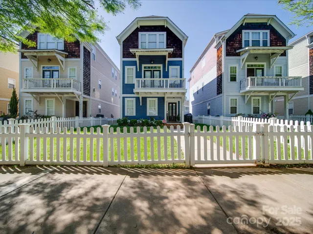 a front view of a house with a fence