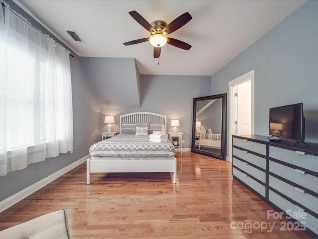 a bedroom with a bed and window