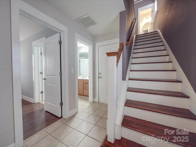 a view of an entryway with wooden floor
