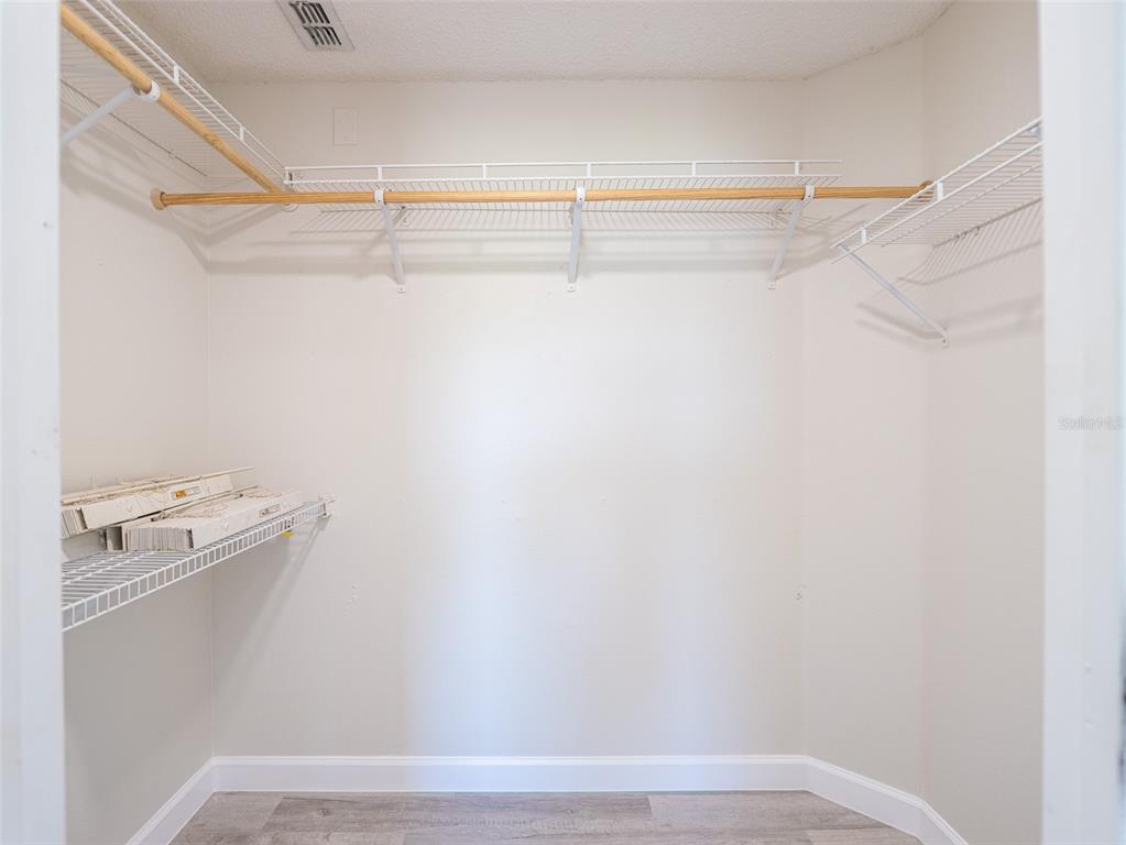 6569 Long Breeze Road Orlando, FL 32810 - Photo 24 of 31 a view of small space with racks on the wall