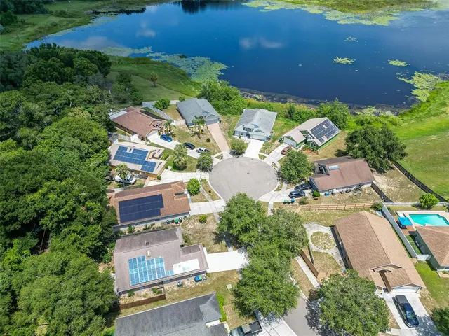 a aerial view of a house with wooden fence