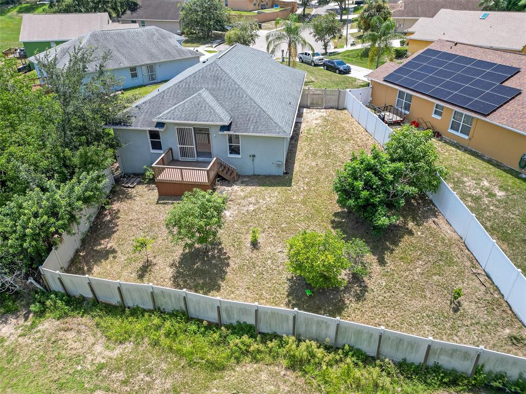 6569 Long Breeze Road Orlando, FL 32810 - Photo 26 of 31 a aerial view of a house with wooden fence