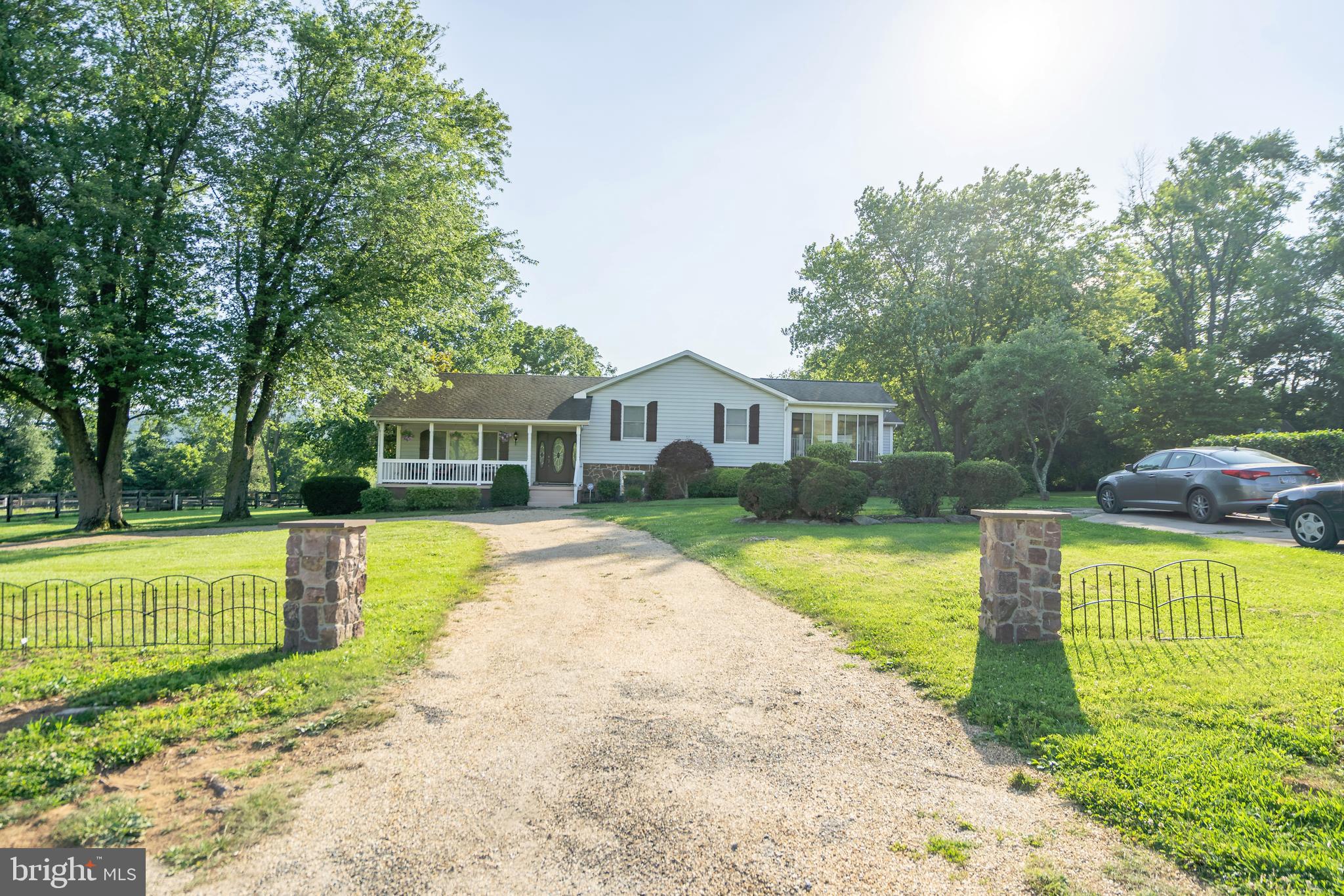 Stone Pillars that Frame the Driveway and House
