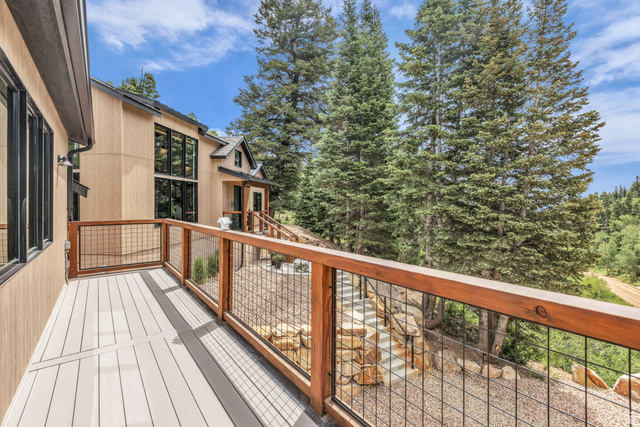 1766 West Tollgate Cyn Road Coalville, UT 84017 - Photo 37 of 59 Outdoor deck featuring composite decking and a wood railing with black mesh infill