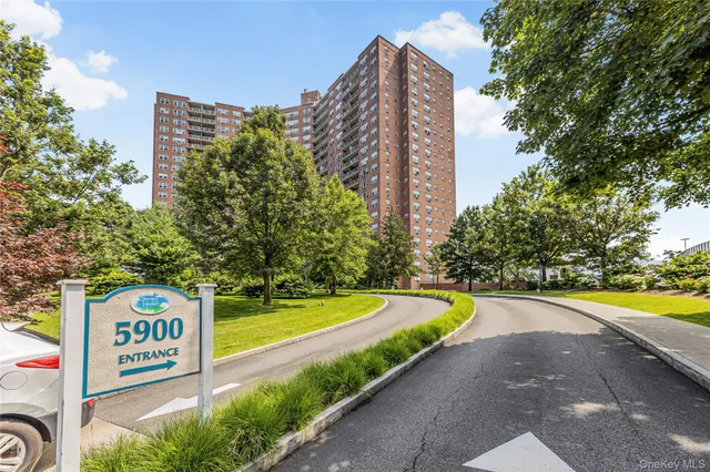 a view of a street with tall buildings