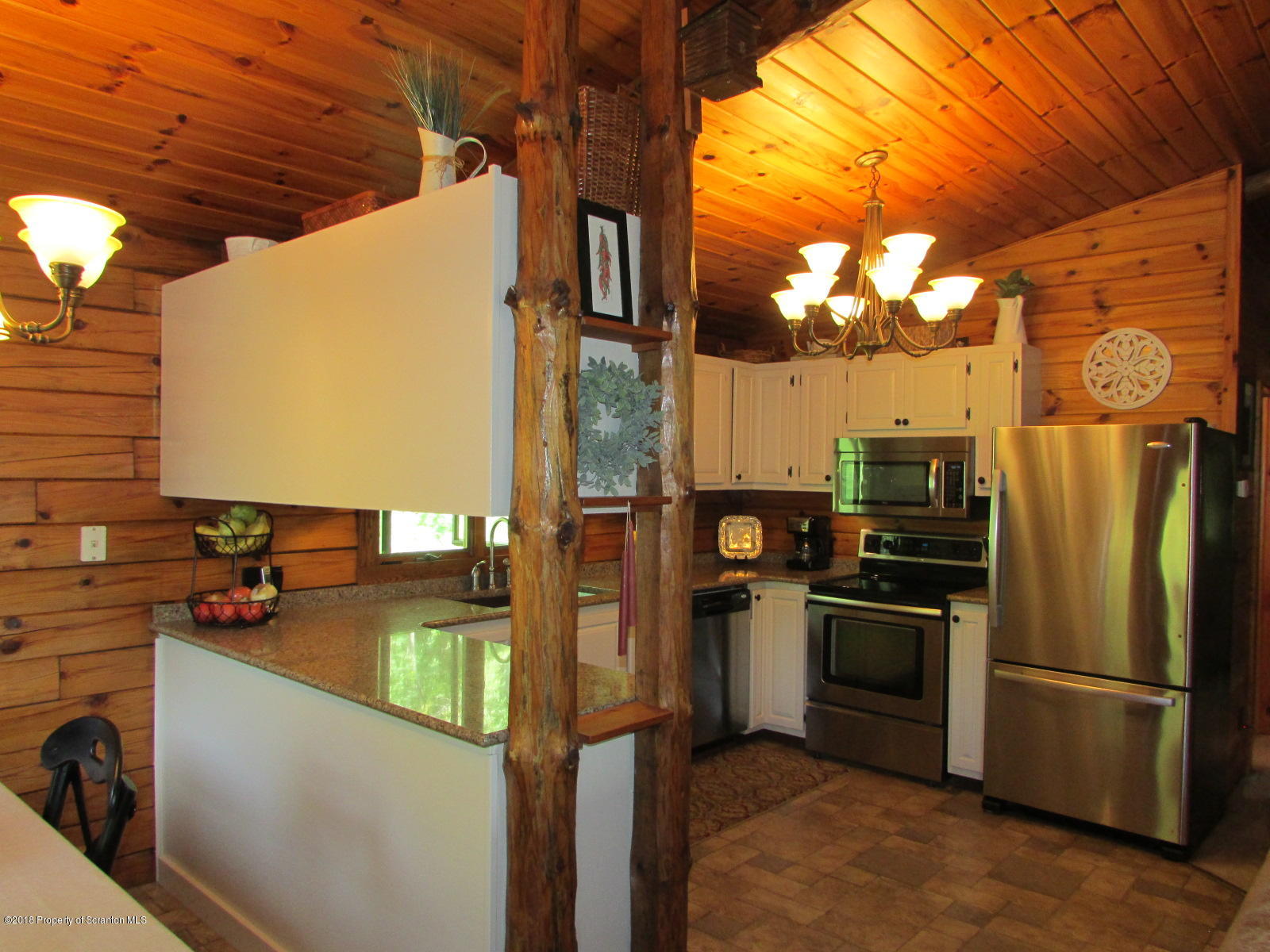 266 Brown Road Montrose, PA 18801 - Photo 11 of 47 a kitchen with stainless steel appliances granite countertop a refrigerator a stove and a sink