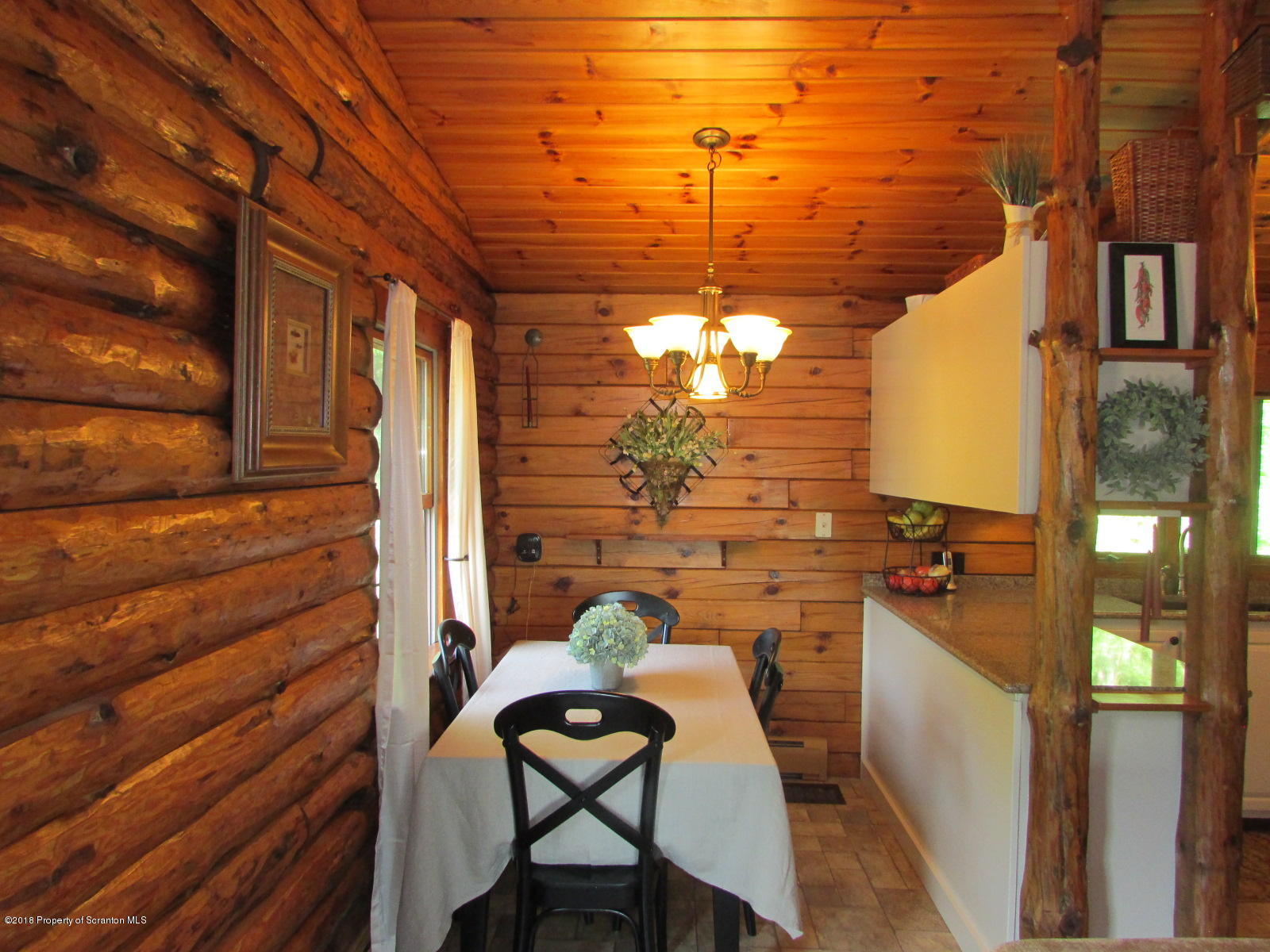 266 Brown Road Montrose, PA 18801 - Photo 13 of 47 a view of a balcony with a table and chairs