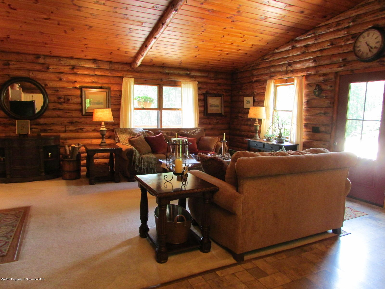 266 Brown Road Montrose, PA 18801 - Photo 17 of 47 a living room with furniture and a large window