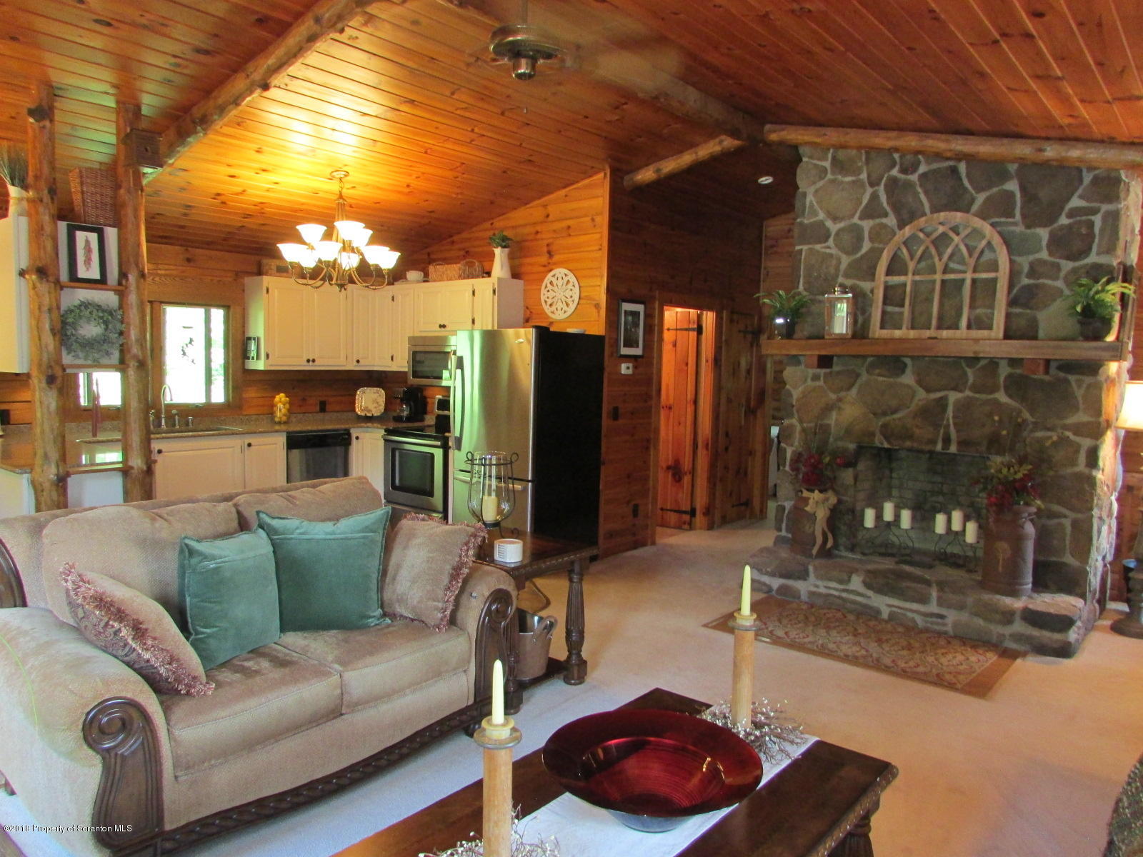 266 Brown Road Montrose, PA 18801 - Photo 19 of 47 a living room with furniture and a fireplace