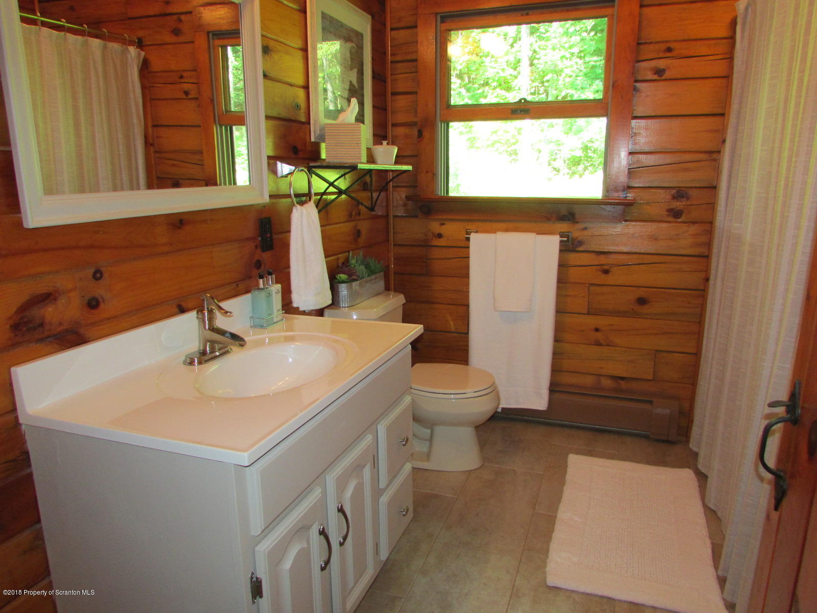 266 Brown Road Montrose, PA 18801 - Photo 21 of 47 a bathroom with a sink a toilet and a window