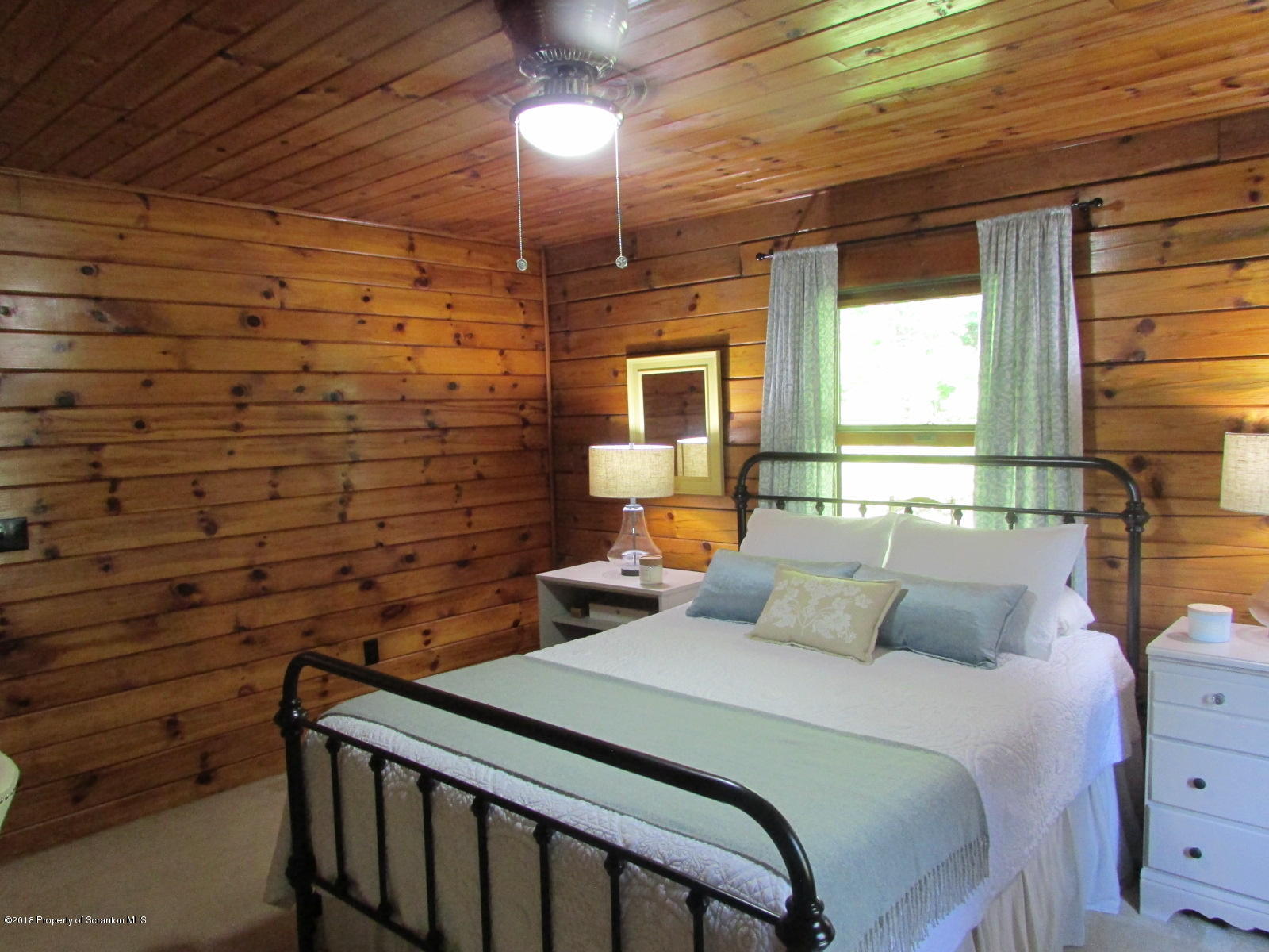266 Brown Road Montrose, PA 18801 - Photo 23 of 47 a bedroom with a bed and a chandelier