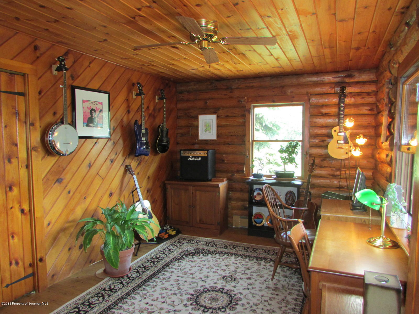 266 Brown Road Montrose, PA 18801 - Photo 24 of 47 a living room with furniture and a window