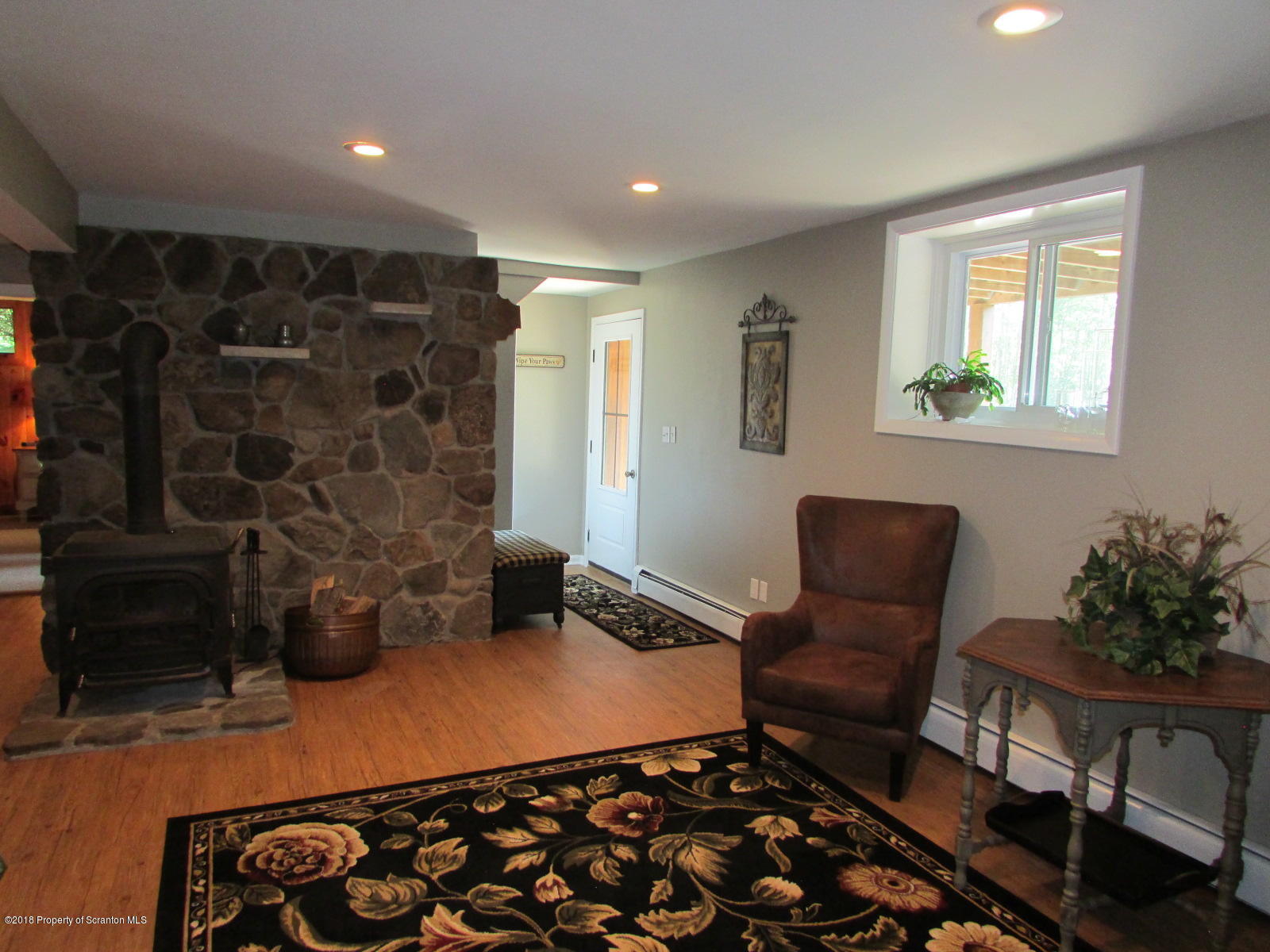 266 Brown Road Montrose, PA 18801 - Photo 28 of 47 a room with wooden floor and furniture