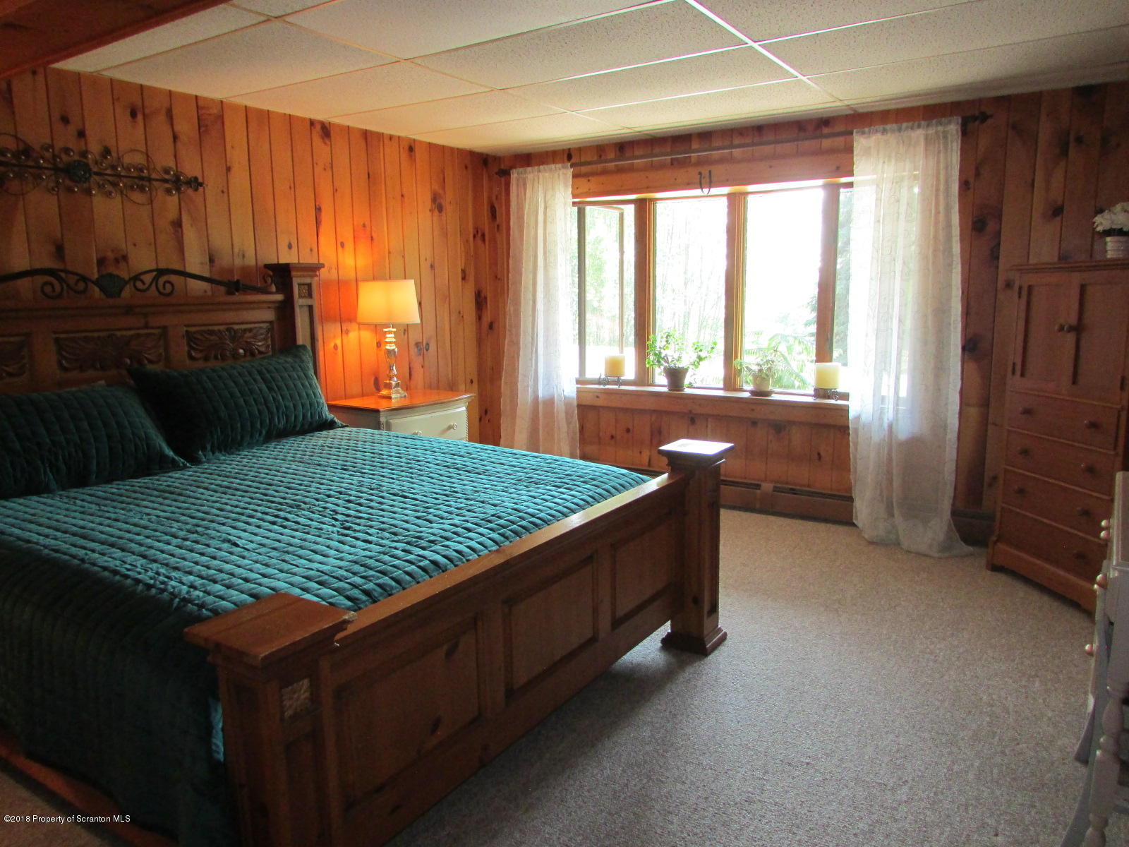 266 Brown Road Montrose, PA 18801 - Photo 32 of 47 a bed sitting in a room next to a window