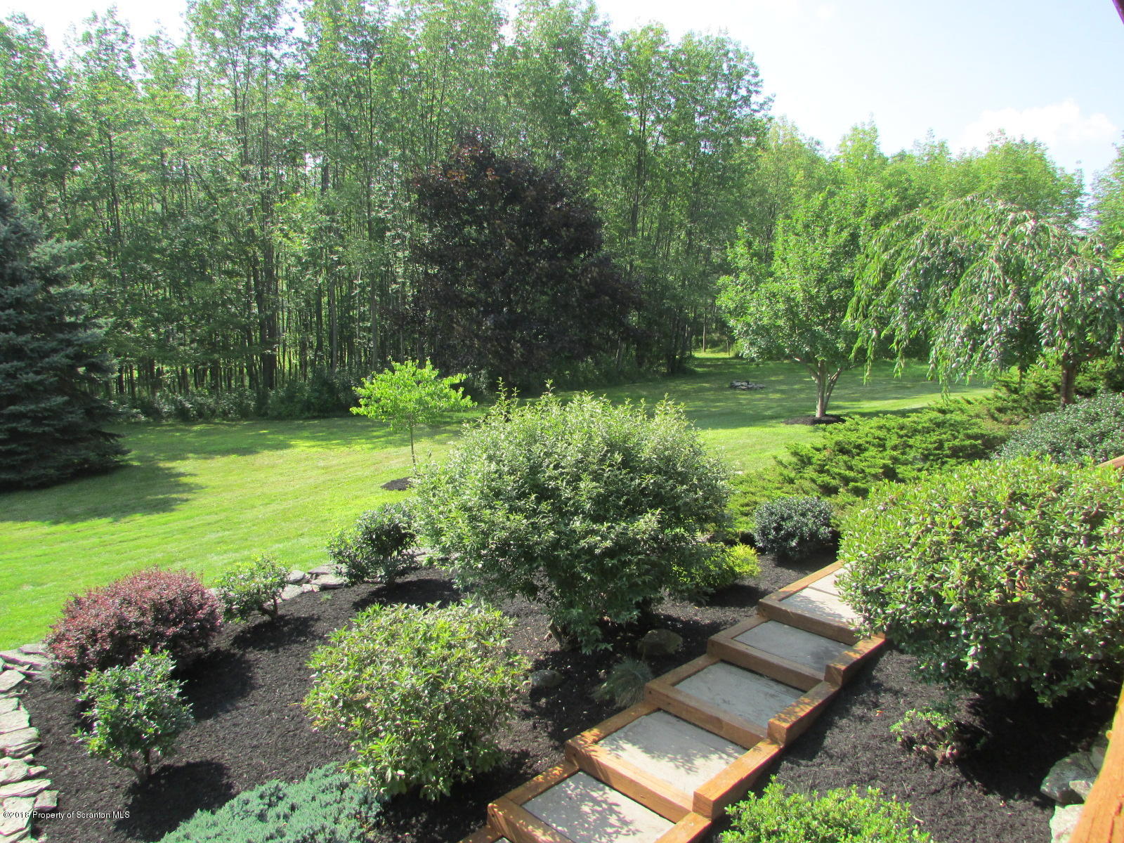 266 Brown Road Montrose, PA 18801 - Photo 41 of 47 a view of a backyard with plants and a garden