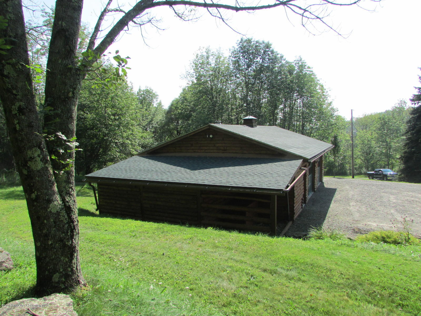 266 Brown Road Montrose, PA 18801 - Photo 46 of 47 a wooden house with a yard