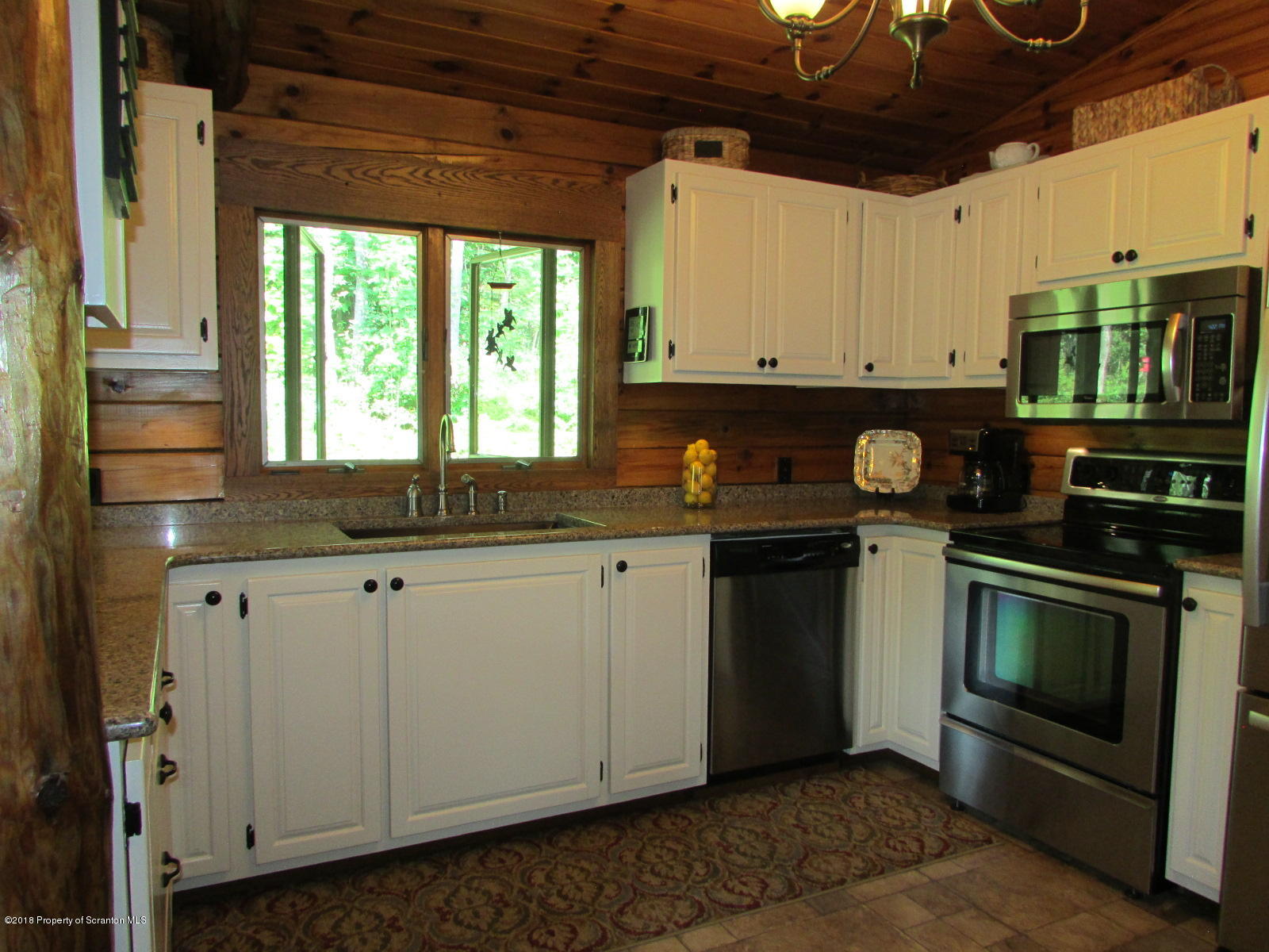 266 Brown Road Montrose, PA 18801 - Photo 9 of 47 a kitchen with stainless steel appliances granite countertop a stove a sink and a microwave