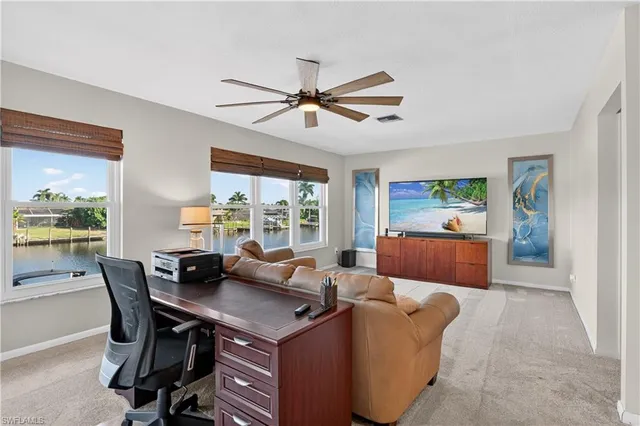 a view of a dining room with furniture window and outside view