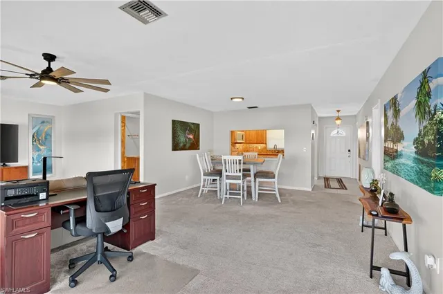 a view of a workspace with furniture