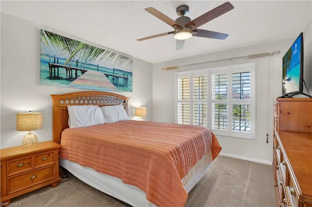 a bedroom with a bed dresser and a window