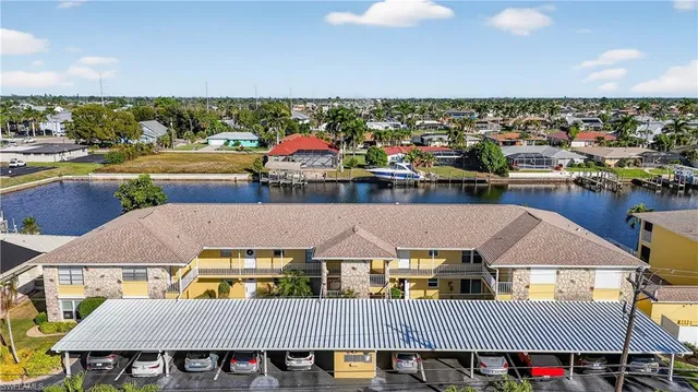 an aerial view of a house with a swimming pool