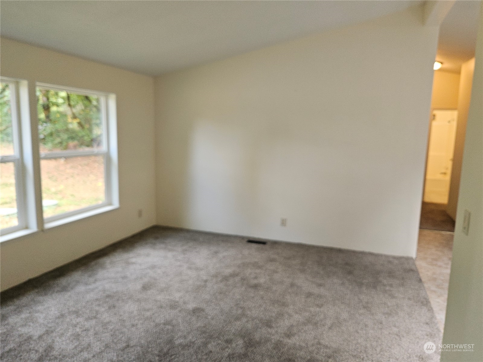 231 Avery Road West Winlock, WA 98596 - Photo 3 of 16 an empty room with a window