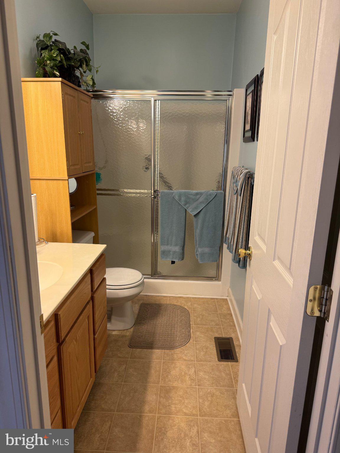 231 Foxglove Loop Bear, DE 19701 - Photo 19 of 30 a bathroom with a granite countertop sink toilet and shower