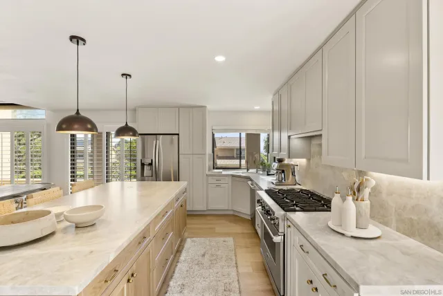 a kitchen with sink cabinets and stove