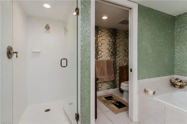 a en suite bathroom with a sink and a mirror