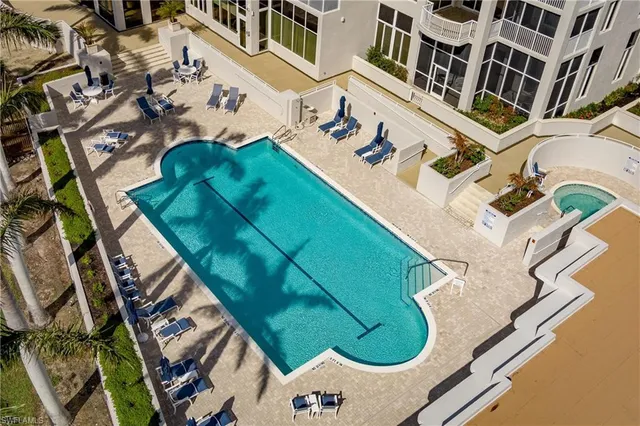 a view of a swimming pool with a patio