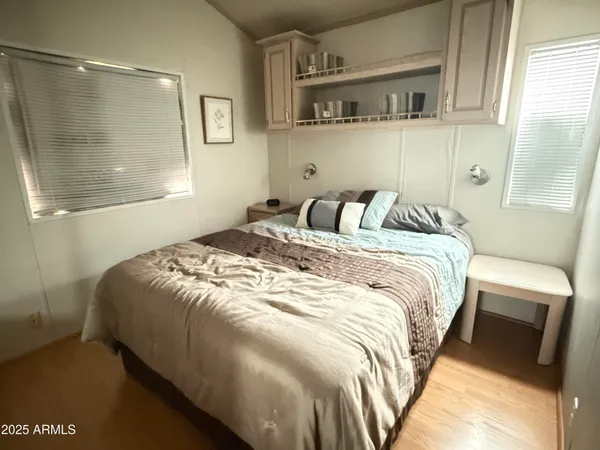 a bedroom with a bed and window