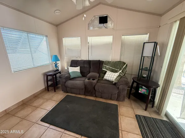 a living room with furniture and a window