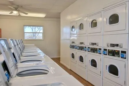 a white stove top oven sitting inside of a kitchen