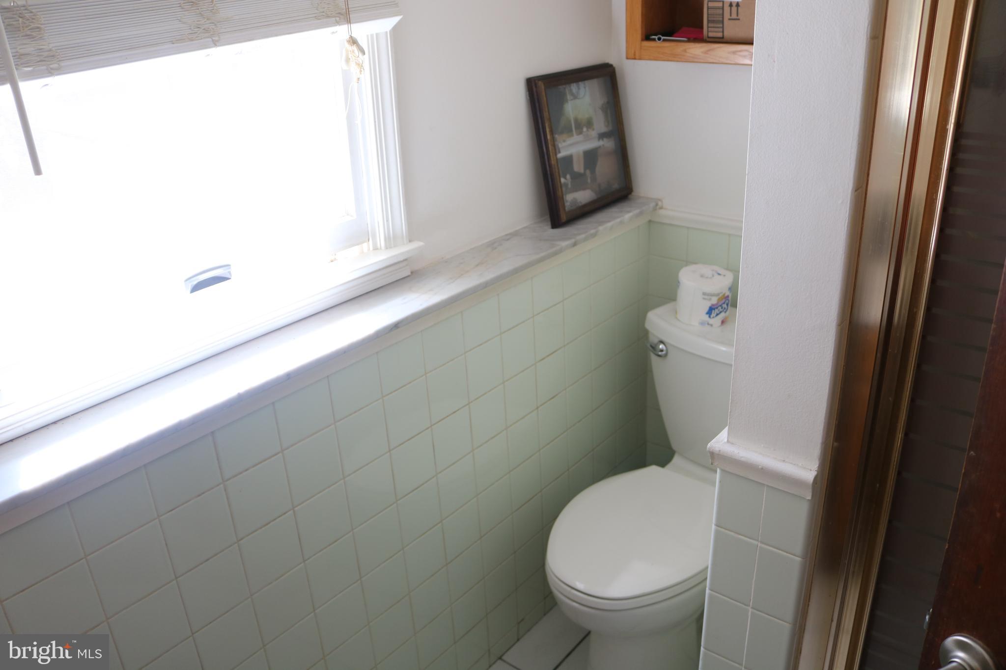 770 Whitehall Road Newfield, NJ 08344 - Photo 54 of 56 a white toilet sitting next to a window