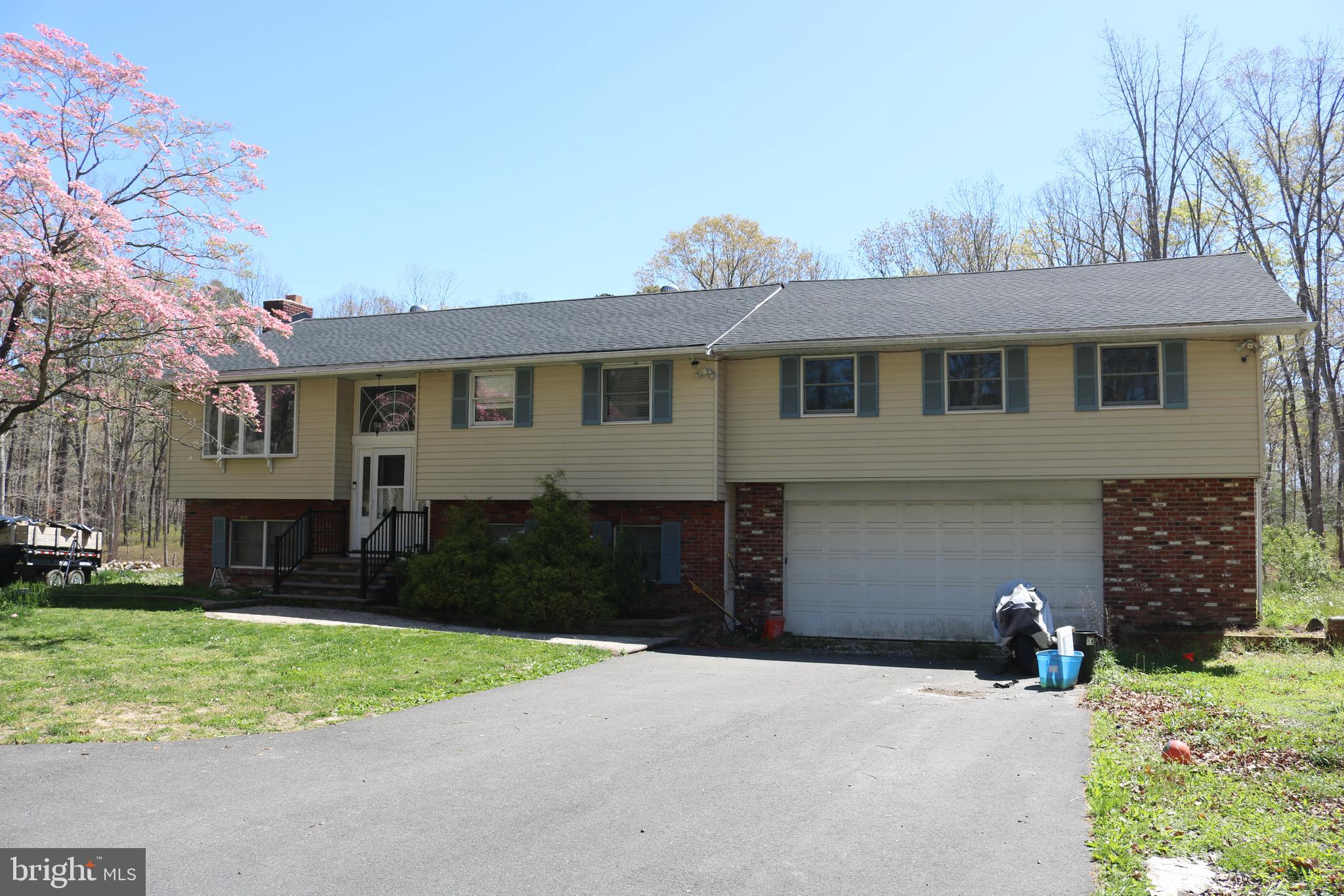 770 Whitehall Road Newfield, NJ 08344 - Photo 8 of 56 a front view of a house with a yard and garage