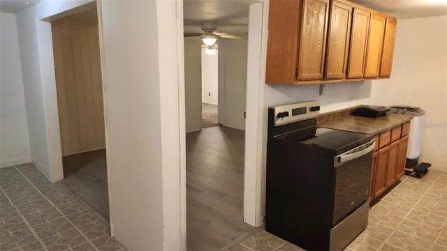 a kitchen with stainless steel appliances granite countertop a stove and a refrigerator
